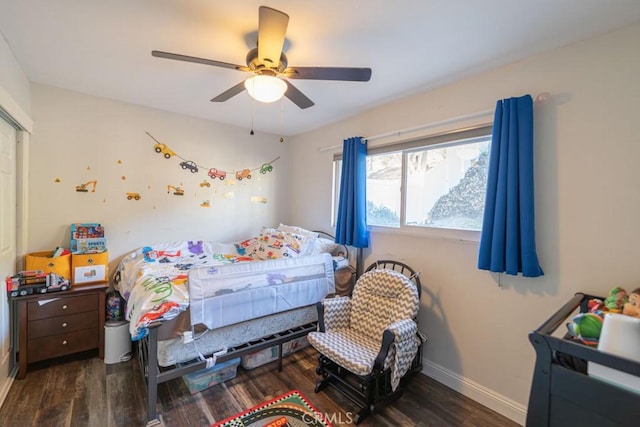 bedroom featuring a ceiling fan, dark wood finished floors, and baseboards