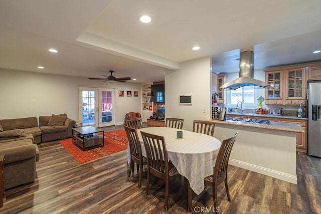 dining room with dark wood-style floors, recessed lighting, and french doors