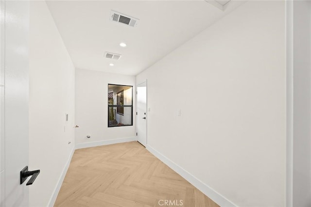 hall with recessed lighting, visible vents, and baseboards