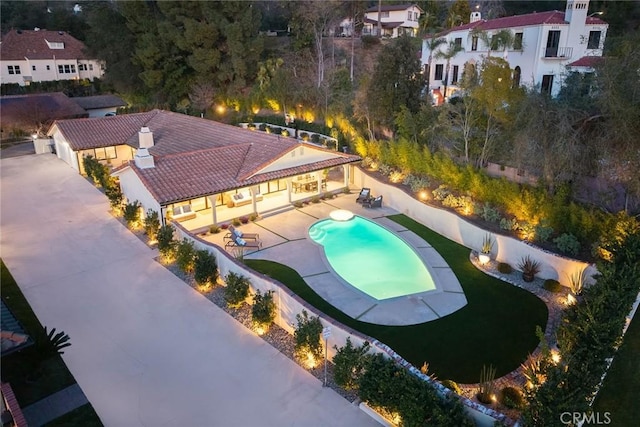 view of swimming pool featuring a fenced backyard, a fenced in pool, and a patio