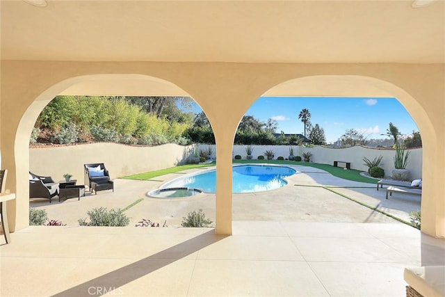 view of pool featuring a patio area, a fenced backyard, and a fenced in pool