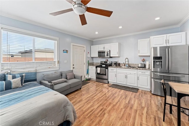 bedroom featuring light wood finished floors, stainless steel fridge with ice dispenser, ornamental molding, a sink, and recessed lighting