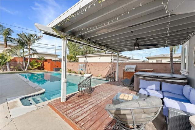 exterior space with a fenced in pool, a fenced backyard, a hot tub, and outdoor lounge area