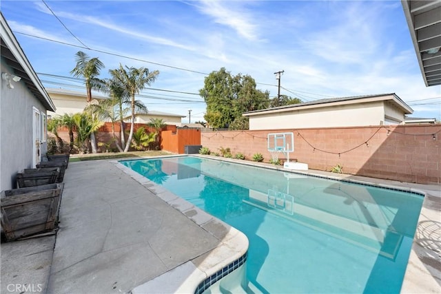 view of swimming pool with a fenced in pool and a fenced backyard