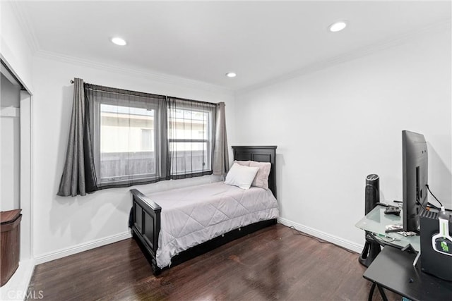 bedroom with crown molding, recessed lighting, dark wood finished floors, and baseboards