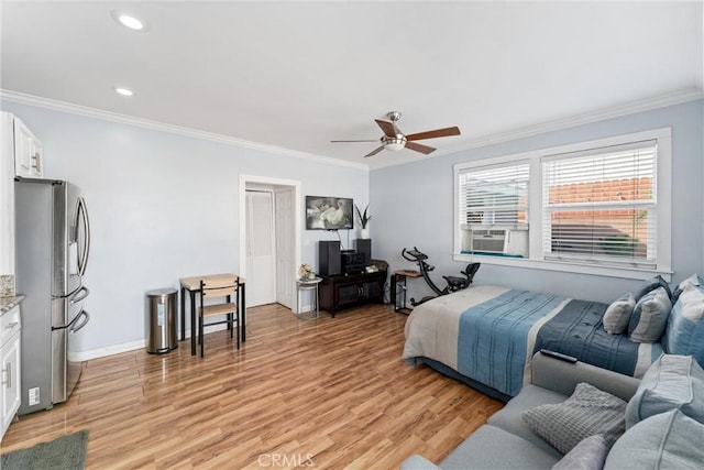 bedroom featuring crown molding, light wood finished floors, recessed lighting, freestanding refrigerator, and cooling unit