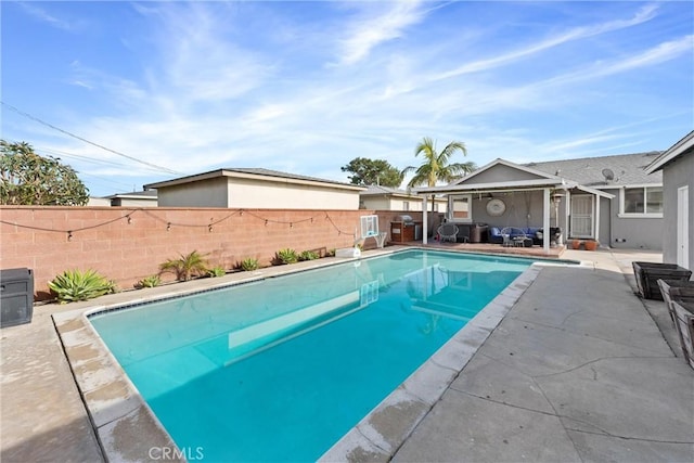 view of pool featuring a fenced backyard, a fenced in pool, and a patio