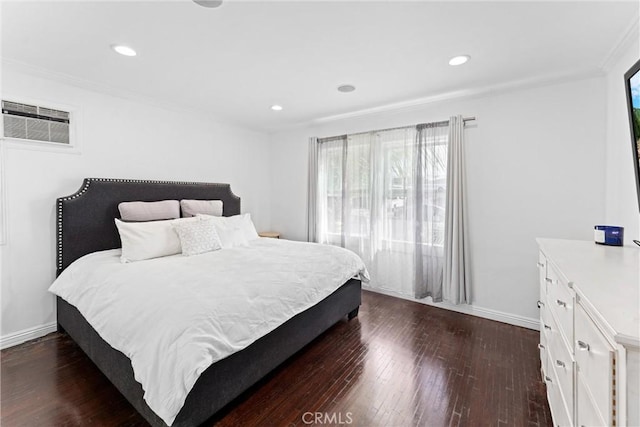 bedroom with dark wood-style floors, baseboards, ornamental molding, and recessed lighting