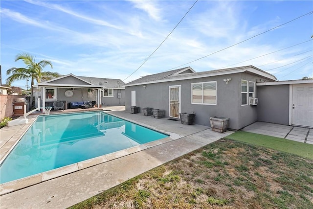 rear view of property with a fenced in pool, fence, cooling unit, a patio area, and stucco siding