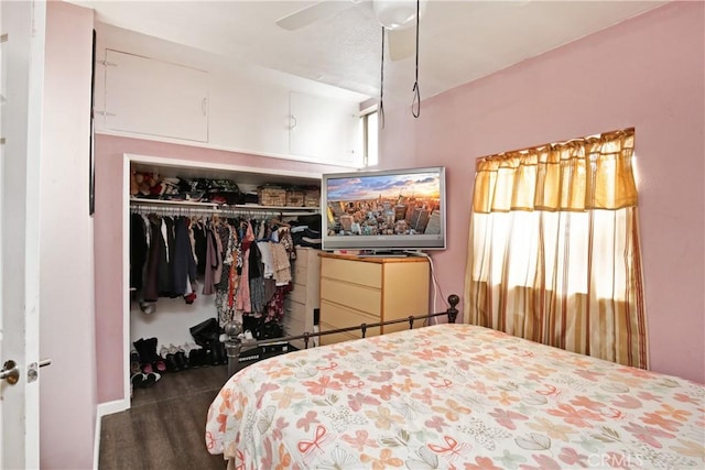 bedroom with ceiling fan and a closet