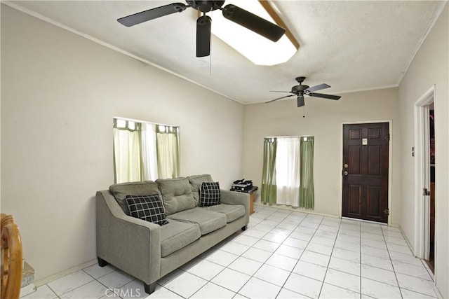 living area with light tile patterned floors, ceiling fan, and crown molding