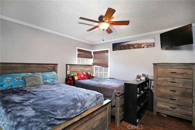 bedroom with ornamental molding, dark wood finished floors, a textured ceiling, and a ceiling fan