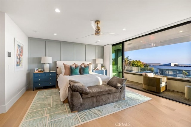 bedroom featuring light wood-style floors, recessed lighting, and baseboards