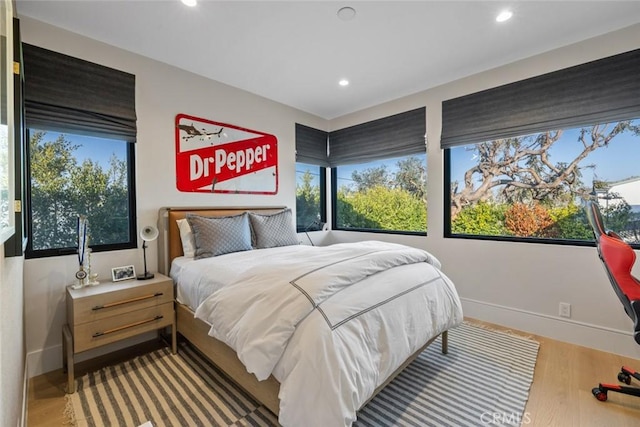 bedroom featuring recessed lighting, baseboards, and wood finished floors