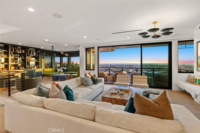 living area with recessed lighting and wood finished floors