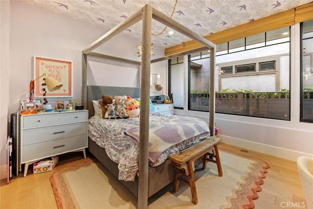 bedroom with light wood finished floors