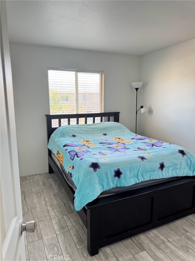 bedroom with light wood finished floors