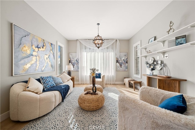 interior space featuring a notable chandelier and baseboards