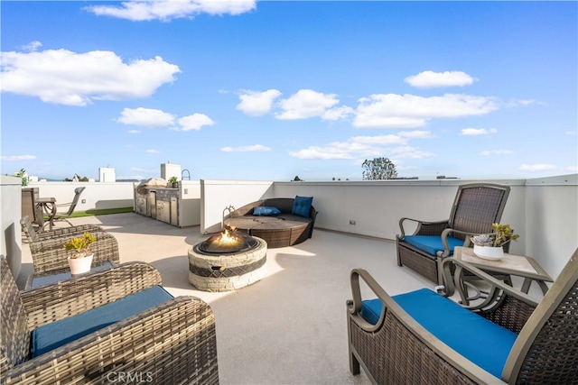 view of patio / terrace with a fire pit