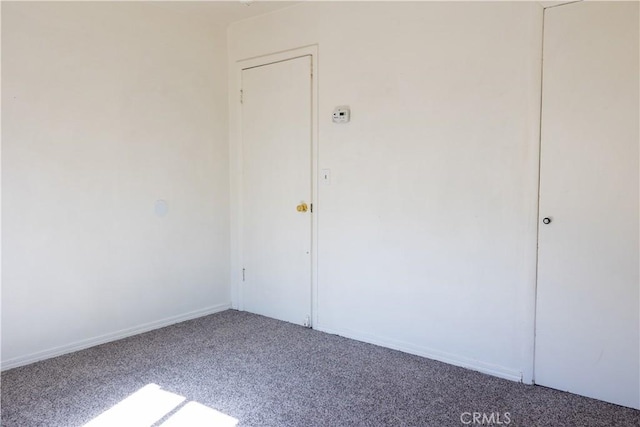 unfurnished room featuring carpet floors