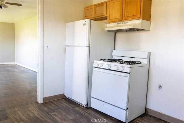 kitchen featuring white appliances, dark wood-type flooring, a ceiling fan, and under cabinet range hood