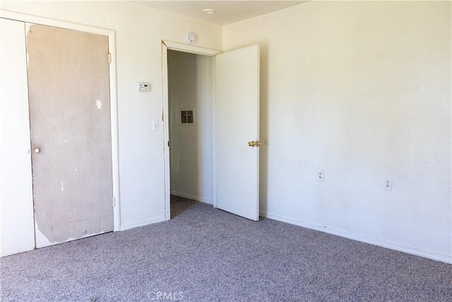 unfurnished bedroom with carpet flooring and visible vents