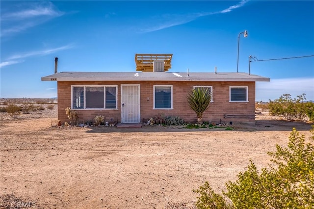 single story home featuring central AC unit