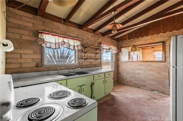 kitchen featuring white electric range oven, brick wall, freestanding refrigerator, light countertops, and a sink