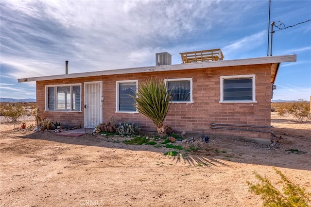 bungalow-style house with brick siding