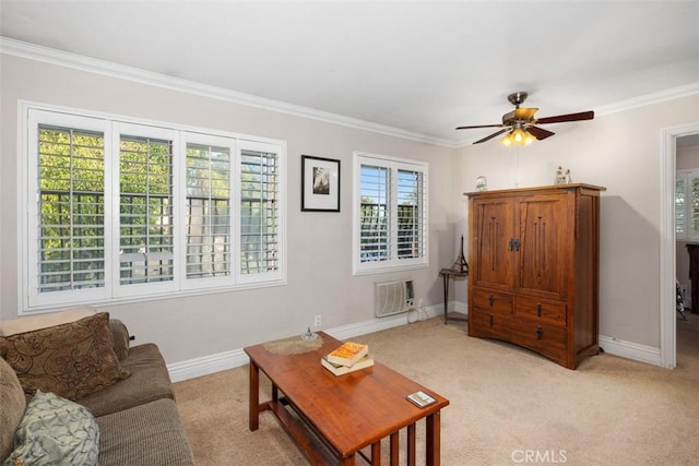 living area featuring crown molding, ceiling fan, light colored carpet, and baseboards