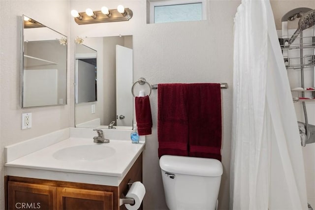 full bath with vanity and toilet