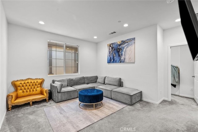 living area with light colored carpet, visible vents, baseboards, and recessed lighting