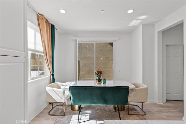 sitting room with baseboards, light wood-type flooring, and recessed lighting