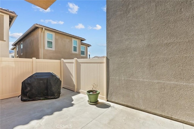 exterior space featuring a fenced backyard and area for grilling