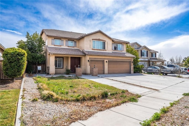 traditional home with stucco siding, driveway, a tile roof, and a garage