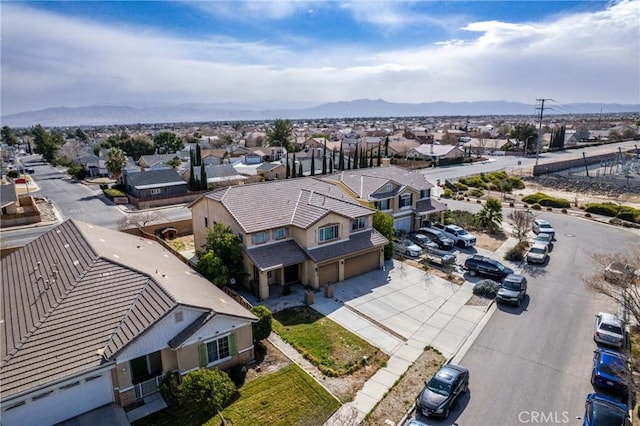 aerial view featuring a mountain view and a residential view