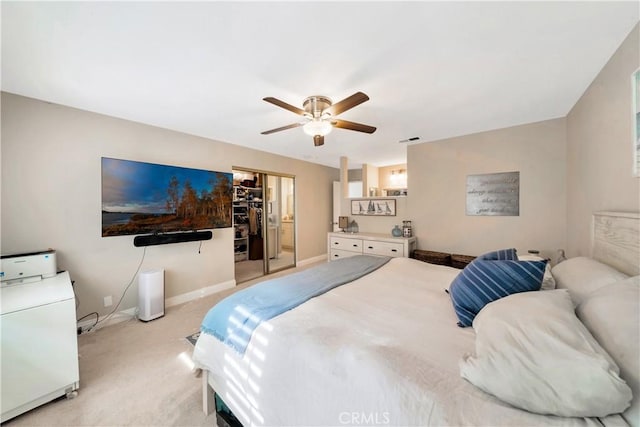 bedroom featuring baseboards, ceiling fan, visible vents, and light colored carpet