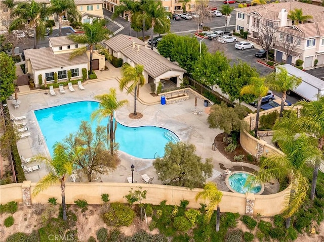 pool featuring a gazebo, a patio area, and a residential view