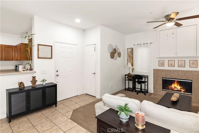 26396 Arboretum Way Unit 2901, Murrieta, CA 92563 - living area with ceiling fan, light tile patterned flooring, a tile fireplace, and recessed lighting