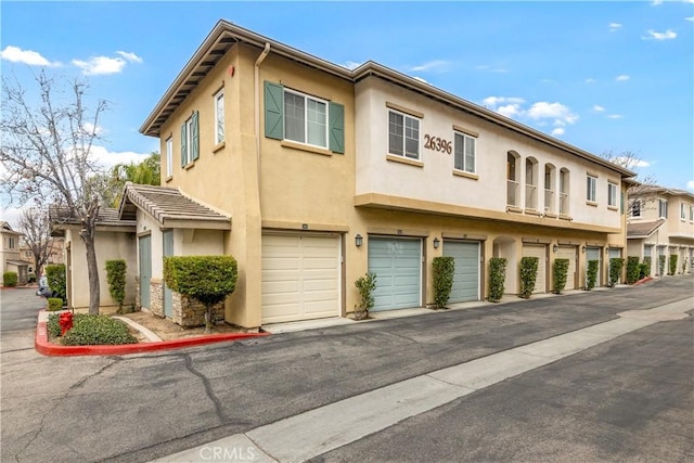 26396 Arboretum Way Unit 2901, Murrieta, CA 92563 - multi unit property with stucco siding and a garage