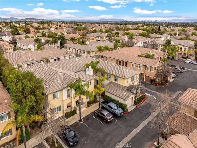 drone / aerial view with a residential view and a mountain view