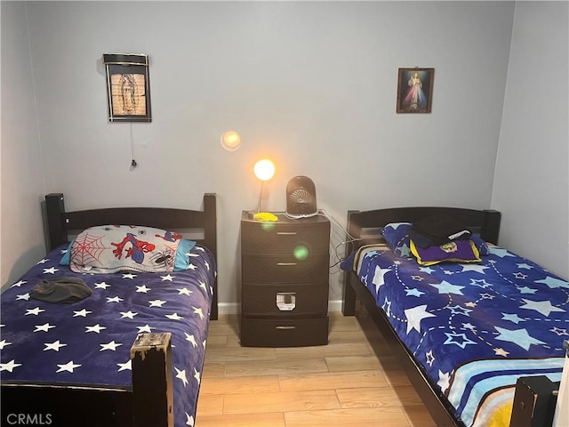 bedroom featuring wood finished floors