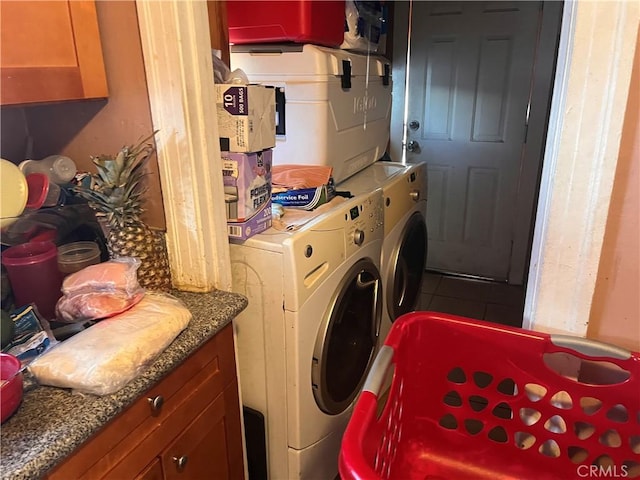 laundry area with laundry area and tile patterned floors