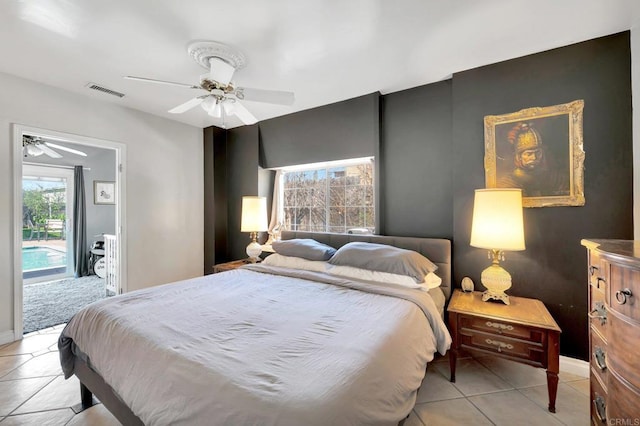 bedroom featuring access to outside, visible vents, a ceiling fan, and light tile patterned flooring