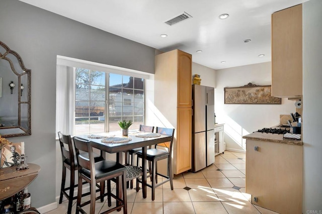 dining room featuring recessed lighting, visible vents, baseboards, and light tile patterned flooring