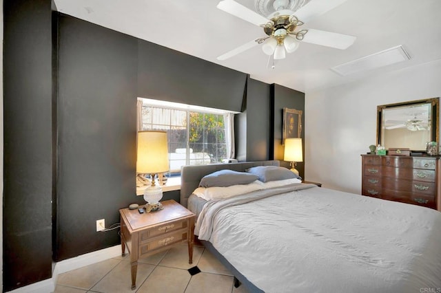 bedroom featuring ceiling fan, baseboards, and light tile patterned floors