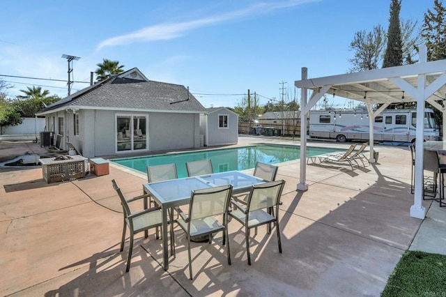 view of pool featuring a fenced in pool, fence, outdoor dining area, central air condition unit, and a patio area