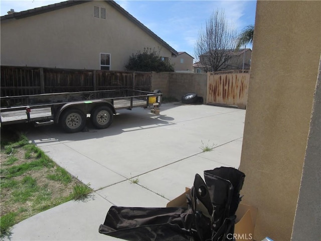 exterior space featuring fence and stucco siding