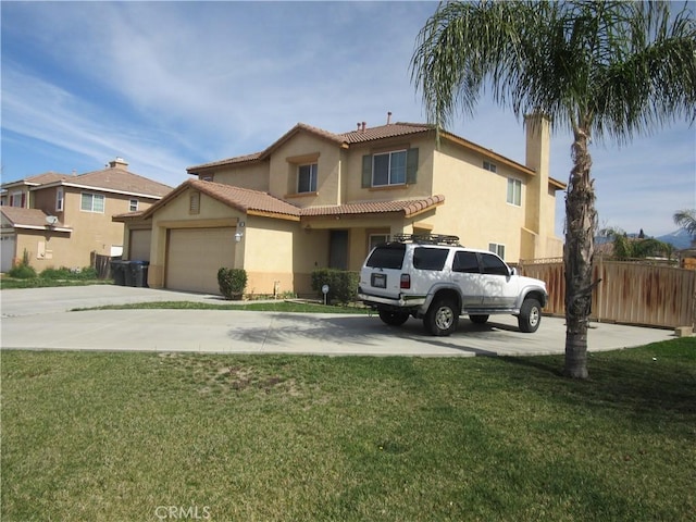 view of front of home featuring driveway, a garage, fence, a front lawn, and stucco siding