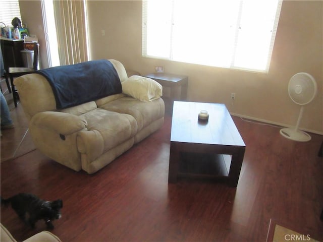 living room featuring wood finished floors and baseboards